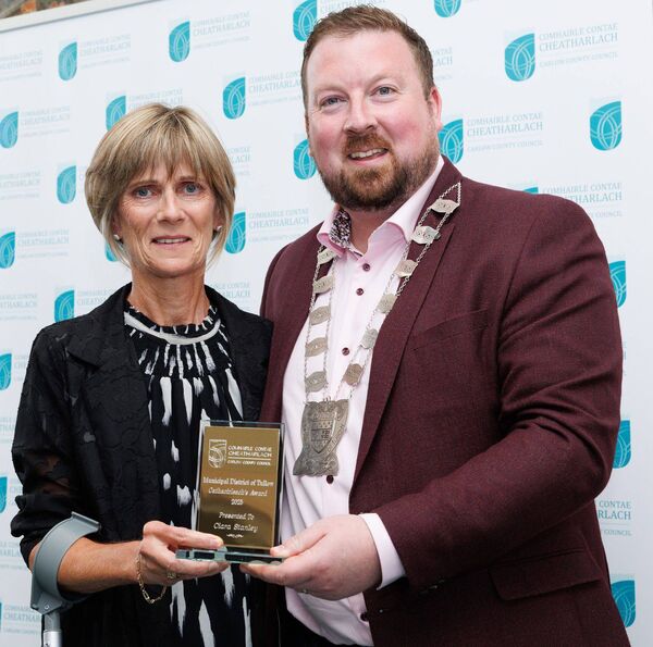 Jean Tomkins accepting the Cathaoirleach Award on behalf of her daughter Ciara Stanley