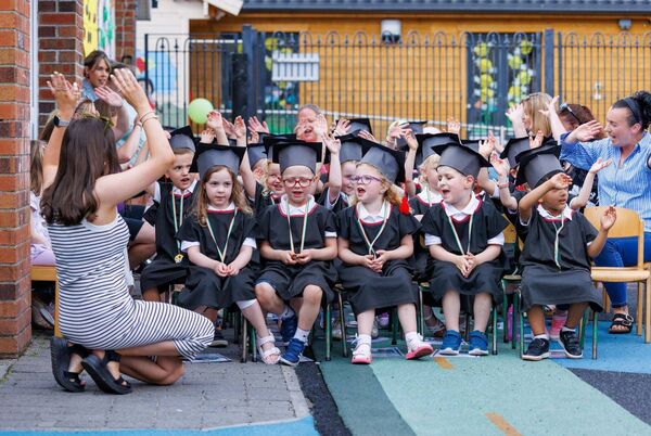 Emma Hendrick leads the children in their graduation song