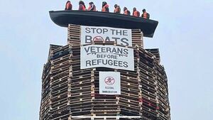 Calls for removal of migrant effigies in boat placed on loyalist bonfire in NI Calls for removal of migrant effigies in boat placed on loyalist bonfire in NI