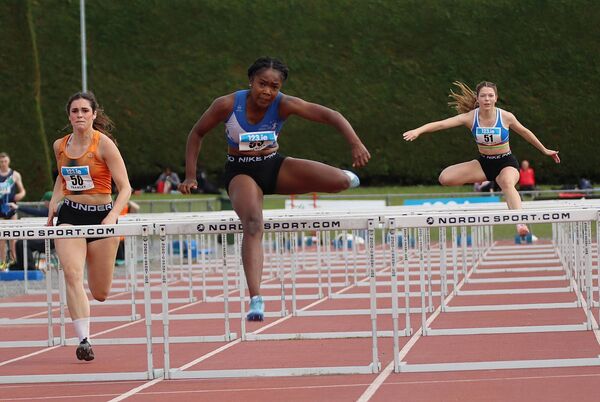 Arabella Adekoya leads the 100m Hurdles with Michaela Subrtova to her right Photo: Perri Williams