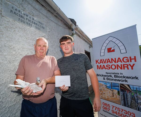 Anthony Kavanagh, winner of the ACE Pigeon competition run by the Carlow and District Racing Pigeon Club, receives the winner's cheque from his grandson Pa Kavanagh, from sponsor Kavanagh Masonry