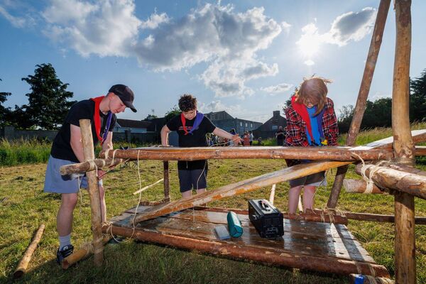 David Walsh, Evan Wood and Patrick Hayes build a preparation table