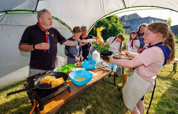 Members of the Beavers make some French toast