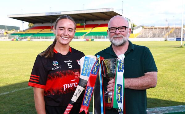 Ger Brennan from Carlow Camogie Club Championship sponsor AZAP Print with Rachel Breen (MLR Captain) Photo: Pat Ahern Ger Brennan from Carlow Camogie Club Championship sponsor AZAP Print with Rachel Breen (MLR Captain) Photo: Pat Ahern
