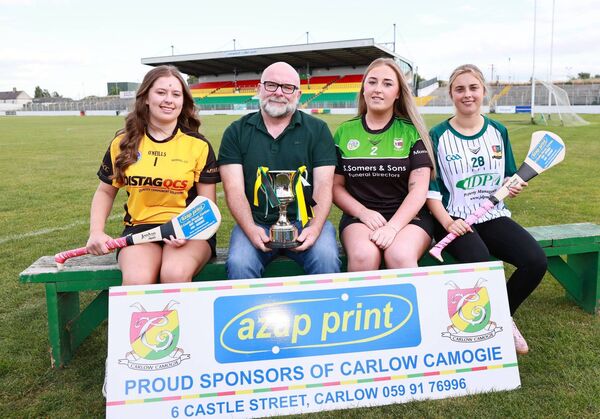 Ger Brennan from AZAP Print with the Carlow intermediate camogie club captains - Mya Farrell (Myshall), Kelsey Cody (Muinebeag) and Amy Moloney (Burren Rangers)