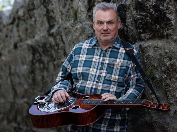 Johnny Gleeson, who performed with his dobro guitar at the variety show Johnny Gleeson, who performed with his dobro guitar at the variety show