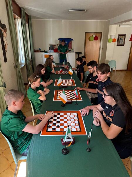On the left are the Bennekerry/Tinryland team of Nuadha Stynes, Sara Donegan, Mia Keating, Wren Stynes and Créd Stynes facing one of the Italian draughts teams On the left are the Bennekerry/Tinryland team of Nuadha Stynes, Sara Donegan, Mia Keating, Wren Stynes and Créd Stynes facing one of the Italian draughts teams