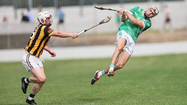 <p>Conor Kehoe goes flying through the air to score a point for St Mullins Photo: Pat Ahern</p>