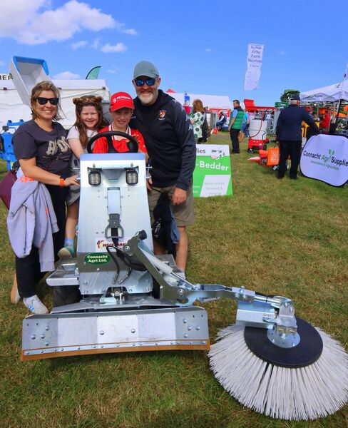 Elaine and Larry McGrath with their children Millie and Odhran on a sweeper at the Tinahely Show Elaine and Larry McGrath with their children Millie and Odhran on a sweeper at the Tinahely Show
