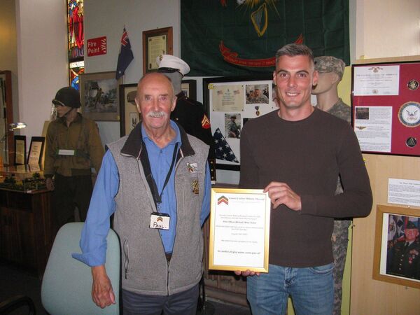Paul Maguire of the military museum with Robby Baker, whose father Michael also died in the helicopter crash