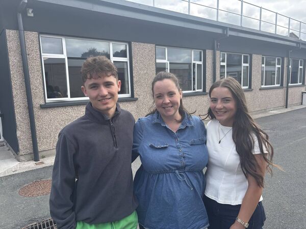 Noah Hayes, Ms Kenny and Grace Mulhal in Coláiste Eoin, Hacketstown Noah Hayes, Ms Kenny and Grace Mulhal in Coláiste Eoin, Hacketstown