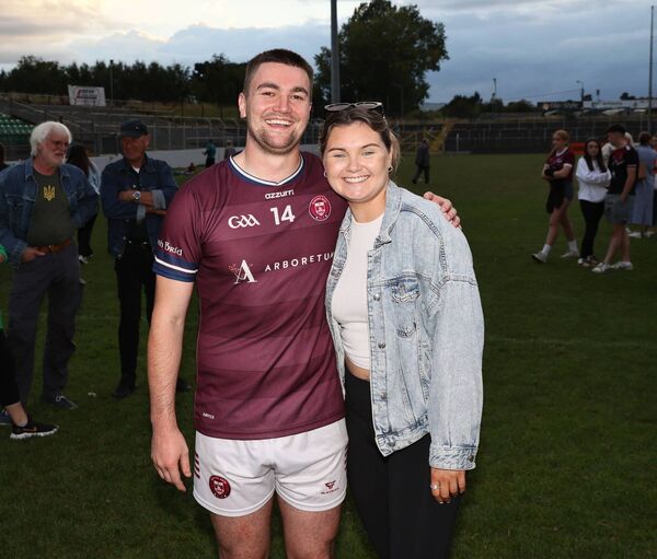 Colin Byrne is congratulated by Kate Nolan after Naomh Bríd's win Colin Byrne is congratulated by Kate Nolan after Naomh Bríd's win
