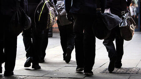 School secretaries and caretakers begin indefinite strike