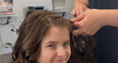 Plucky Lily cuts off her long locks for three cancer charities 