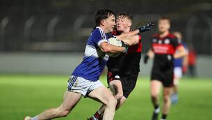 <p>Tadhg Roche (Old Leighlin) tries to get past MOunt Leinster Rangers defender Tim Brennan Photo: Pat Ahern</p>