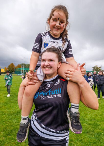 Fenagh’s Niamh Treacy with young supporter Evelyn Murphy following her side's victory.