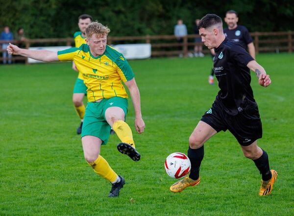 New Oak’s Dean Kelly takes the ball beyond Crettyard’s Russell Kealy. Photo:© Michael O'Rourke Photography 2025