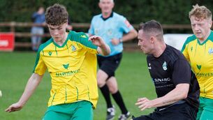 <p>Crettyard’s Riogan Doran tries to sidestep past New Oak’s Shane Barnes. Pic:© Michael O'Rourke Photography 2025</p>