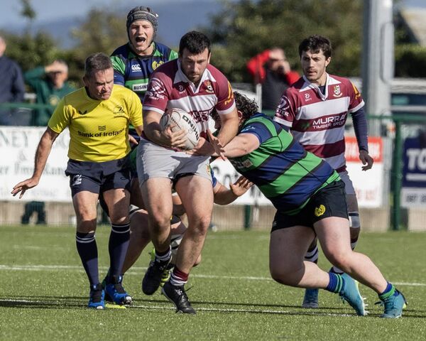 Tullow's Tom Cashen is tackled by Seapoint's Gordan Britchfield.