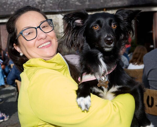 Maria Oliveira with her dog Socks