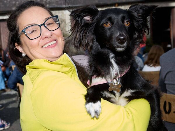 Maria Oliveira with her dog Socks