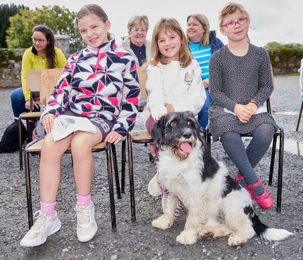 Lily Curtin, Daisy James (centre) and Cara Curtin with Daisy's dog Walter during the service for the blessing of the animals at St Mary's and Urglin Church of Ireland, Carlow