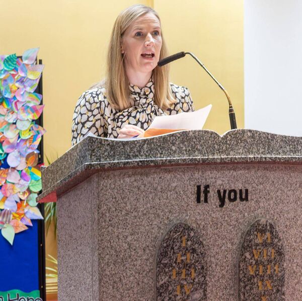 Principal Mairead Mullally explains the symbols brought by the pupils to the altar