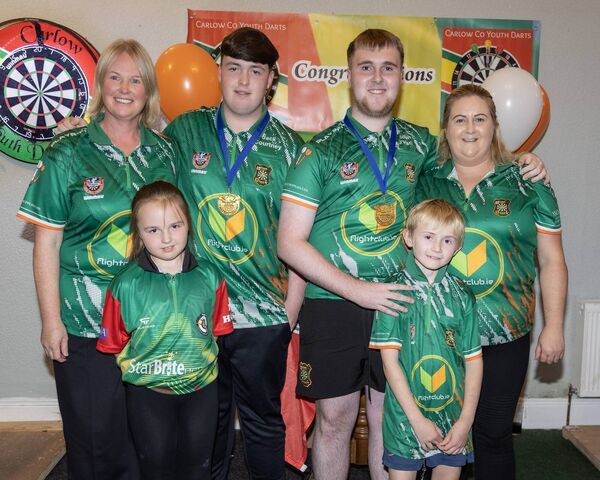 At the homecoming for Ireland darts champions Jack Courtney and Aidan O'Hara are Marian and Jack Courtney, Aidan O'Hara, Sandra Slattery. F/R; Ruby Courtney and Billy Slattery.