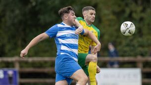 <p>Gearoid Cuddihy scored his first goal after a two year injury lay off. He's pictured trying to beat Ricky Lawler.</p>