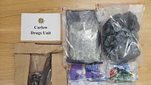 <p>A garda photo of some of the drugs and weapons seized in the Carlow town raids</p>