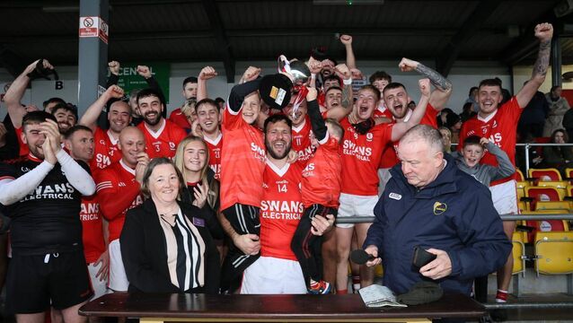 <p>Derek Hayden leads the celebrations for Éire Óg Photo: Pat Ahern</p>