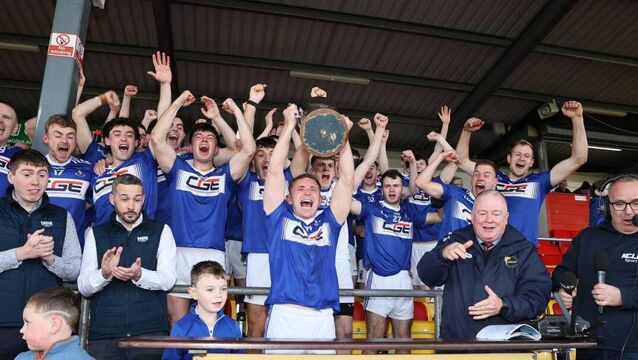 <p>Old Leighlin captain Aaron Amond lifts the Nationalist Cup as they clinched the Michael Lyng Motors Senior Football Championship Photo: Pat Ahern</p>