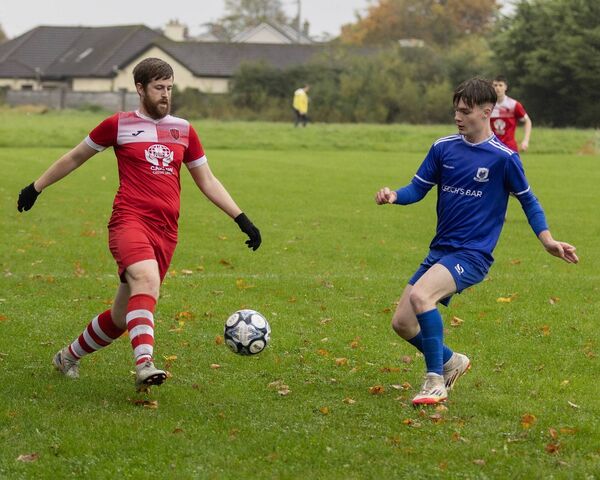 Castle Rangers Travis Timmins tries to beat Wolfhill's James Keating. Castle Rangers Travis Timmins tries to beat Wolfhill's James Keating.