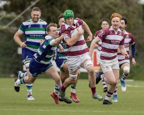 Tullow's Tom Hughes breaks the tackle of Suttonians' Josh Oakley. Tullow's Tom Hughes breaks the tackle of Suttonians' Josh Oakley.