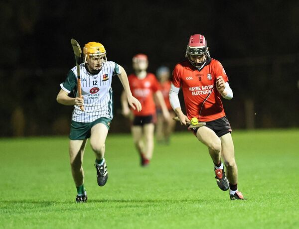 Kildavin-Clonegal's Eoghan Treacy goes on a solo with Burren Rangers' Will O'Toole giving chase. Kildavin-Clonegal's Eoghan Treacy goes on a solo with Burren Rangers' Will O'Toole giving chase.