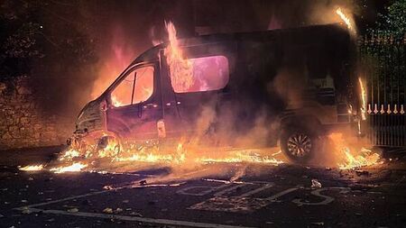 Fireworks launched at gardaí, Garda van set alight, in clash with protesters at Citywest