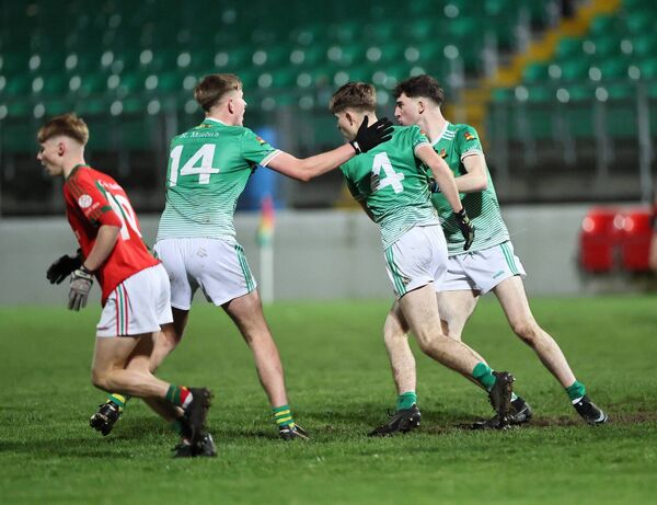 Dylan Ruane is congratulated for scoring a late point for St Martin's Photo: Pat Ahern Dylan Ruane is congratulated for scoring a late point for St Martin's Photo: Pat Ahern