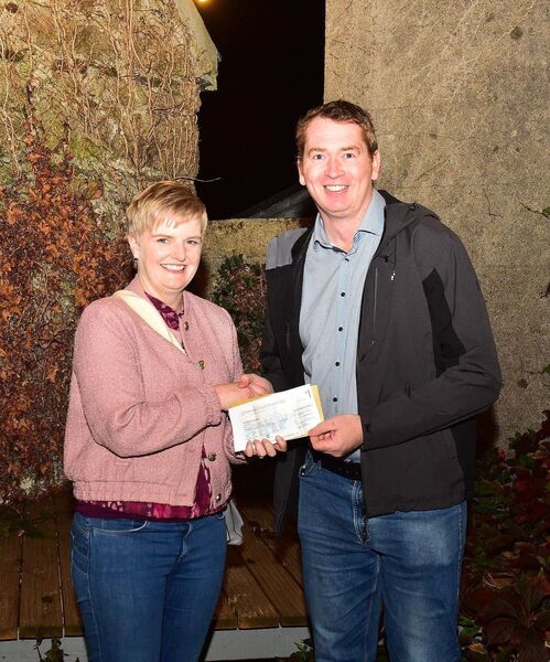 Kevin Fitzpatrick presents a cheque for €1,000 to the Holy Angels representative Miriam Murphy Photos: Roger Jones Kevin Fitzpatrick presents a cheque for €1,000 to the Holy Angels representative Miriam Murphy Photos: Roger Jones