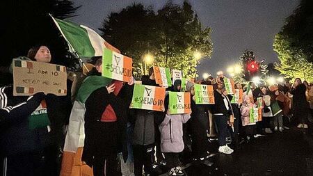 Protesters let off pink smoke during asylum demonstration at Citywest