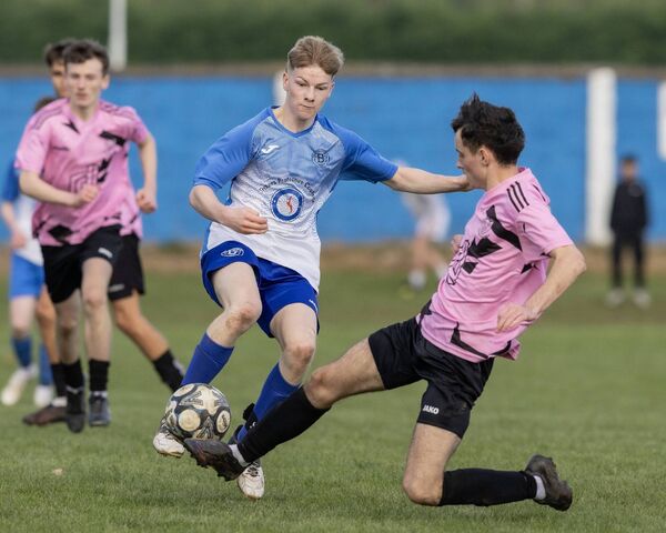 Bagenalstown's David Brennan and Wexford's Harly Maher battle for the ball. Bagenalstown's David Brennan and Wexford's Harly Maher battle for the ball.