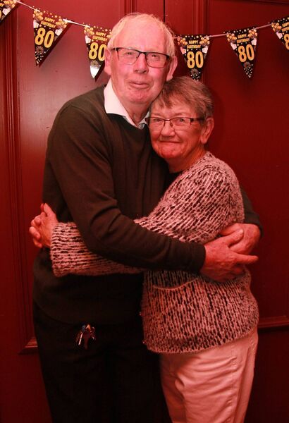 Teresa gets a birthday hug from her husband, Kevin 