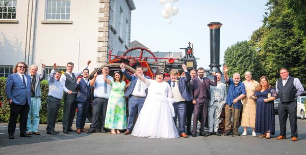 Tommy and Lisa Fogarty with their friends and family, and Patricia the tractor. Photo by John O’Carroll. Tommy and Lisa Fogarty with their friends and family, and Patricia the tractor. Photo by John O’Carroll.