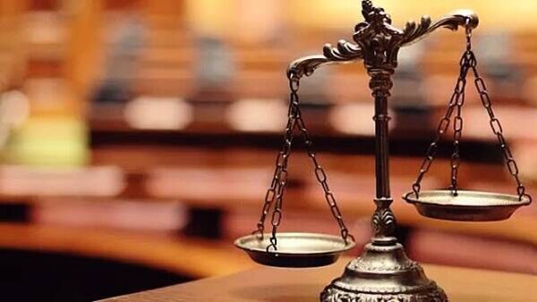Man has assault conviction for spitting on neighbour overturned