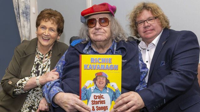 <p>Richie Kavanagh with his wife Nancy and son James during the launch of his book in the Arboretum.</p>