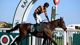 <p>Patrick Mullins crosses the finishing line on Nick Rockett to win the Aintree Grand National Photo: Pat Healy</p>