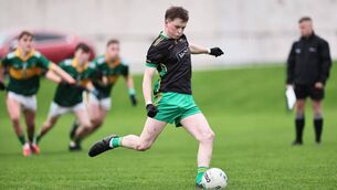 <p>Aaron Dowling converts an early first-half penalty for the Fighting Cocks against Clann na nGael in the Leinster Junior Football Championship at COE Fenagh.</p>