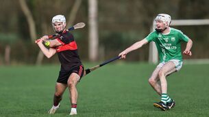 <p>Naomh Moling's Diarmuid Power cannot prevent Mount Leinster Rangers' Donagh Muprhy from scoring one of his seven points. </p>