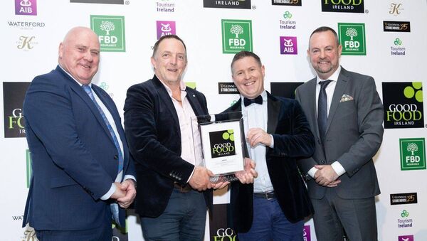 The Malones from Malone's Fruit Farm are presented with their award 