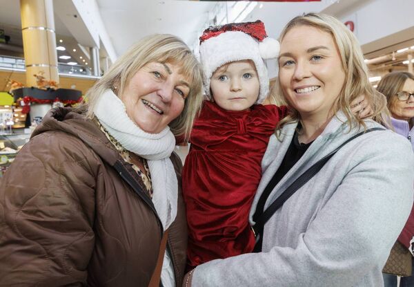 Pictured in the Fairgreen Shopping Centre waiting on the arrival of Santa Claus were Theresa Whelan, her daughter Niamh Kirwan and granddaughter Freya