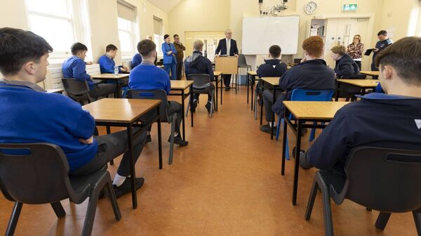 Minister Michael Moynihan addressing the fifth and sixth year politics and society class during his visit to St Mary's Knockbeg College
